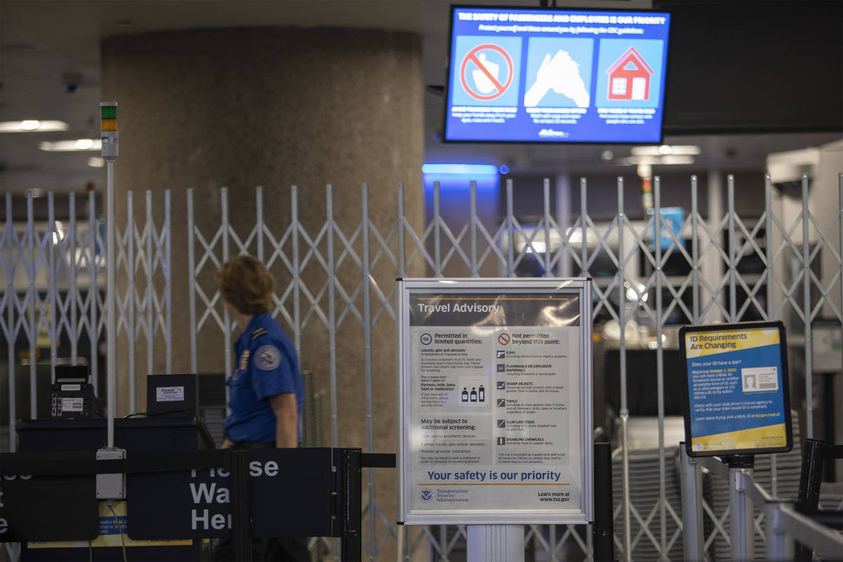 A sign notifying travelers of Gov. Steve Sisolak's recently implemented travel advisory, asking ...