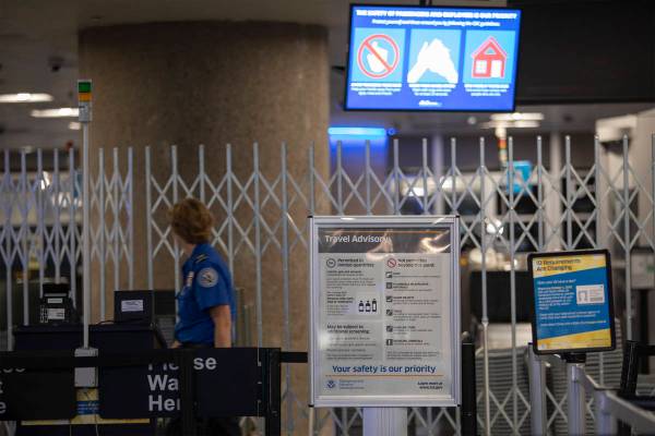 A sign notifying travelers of Gov. Steve Sisolak's recently implemented travel advisory, asking ...