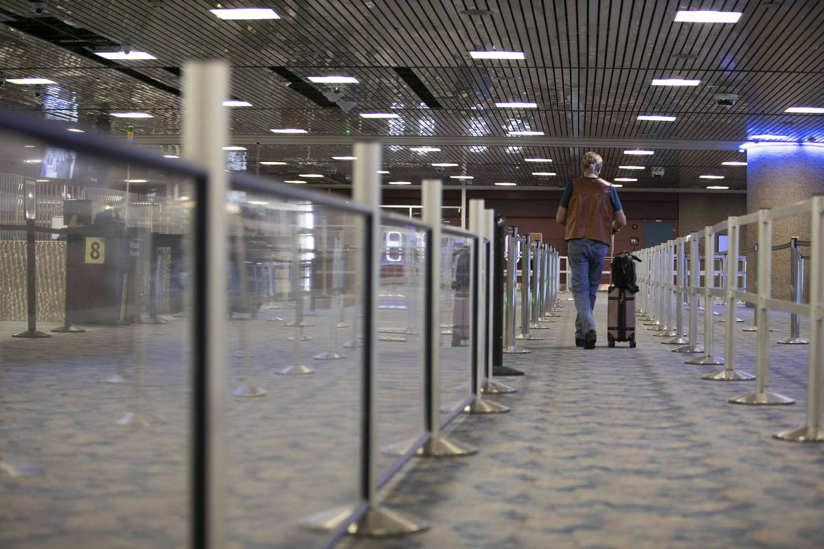 A single traveler makes way through a nonexistent line for security at McCarran International A ...