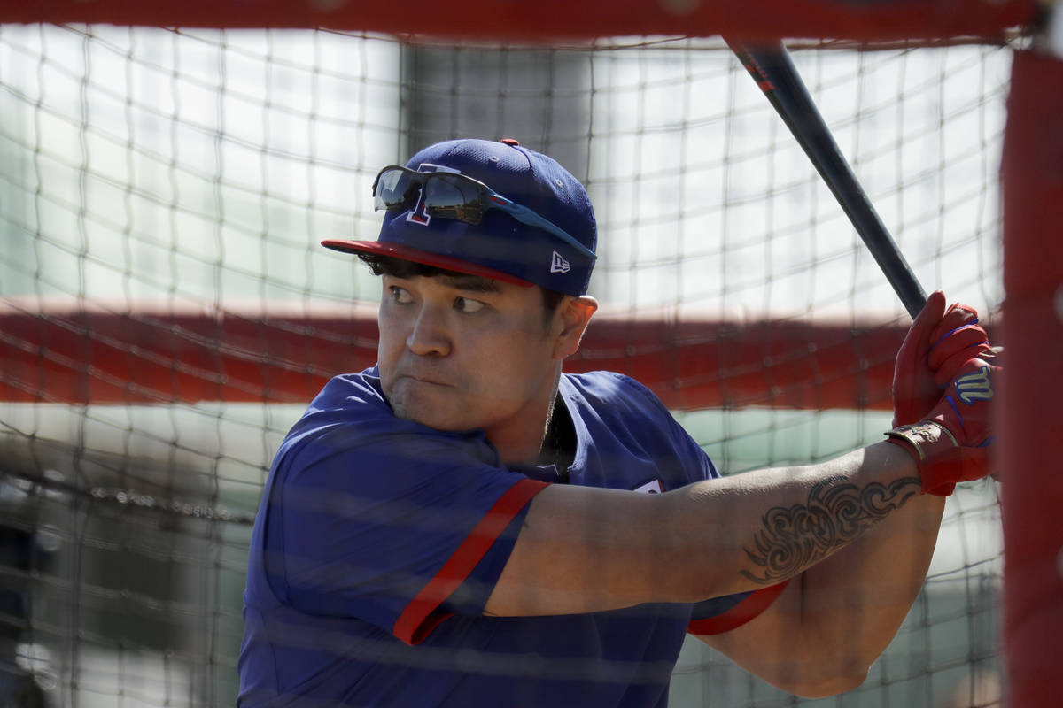 Texas Rangers' Shin-Soo Choo bats during spring training baseball practice Monday, Feb. 17, 202 ...