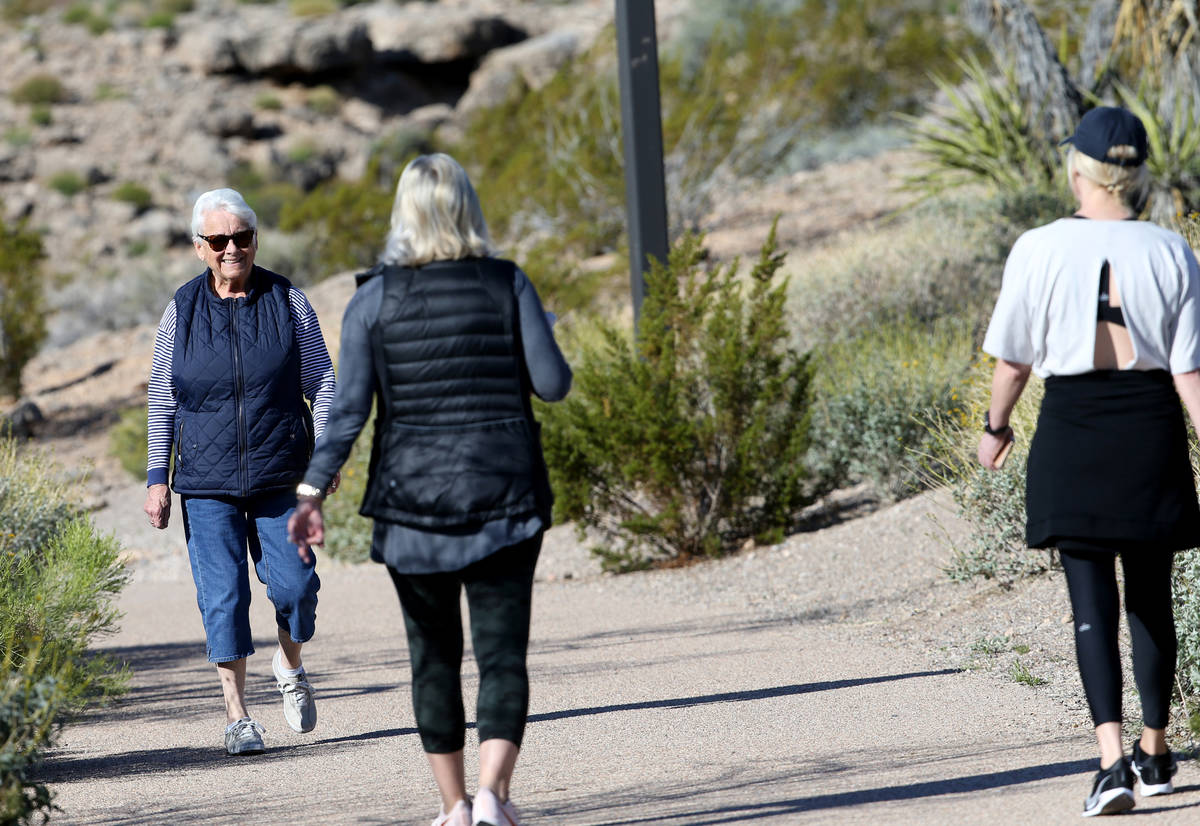 Gretchen Sederman, 83, smiles at Kelly Iriye, right, and Stephanie Cearlock, all of Las Vegas, ...