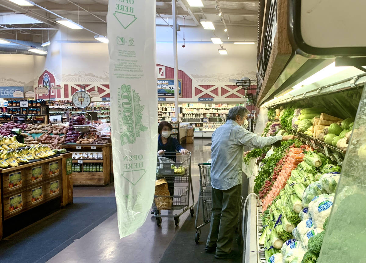 Shoppers pick fresh produce at the Sprouts Farmers Market on N Stephanie Street in Henderson on ...