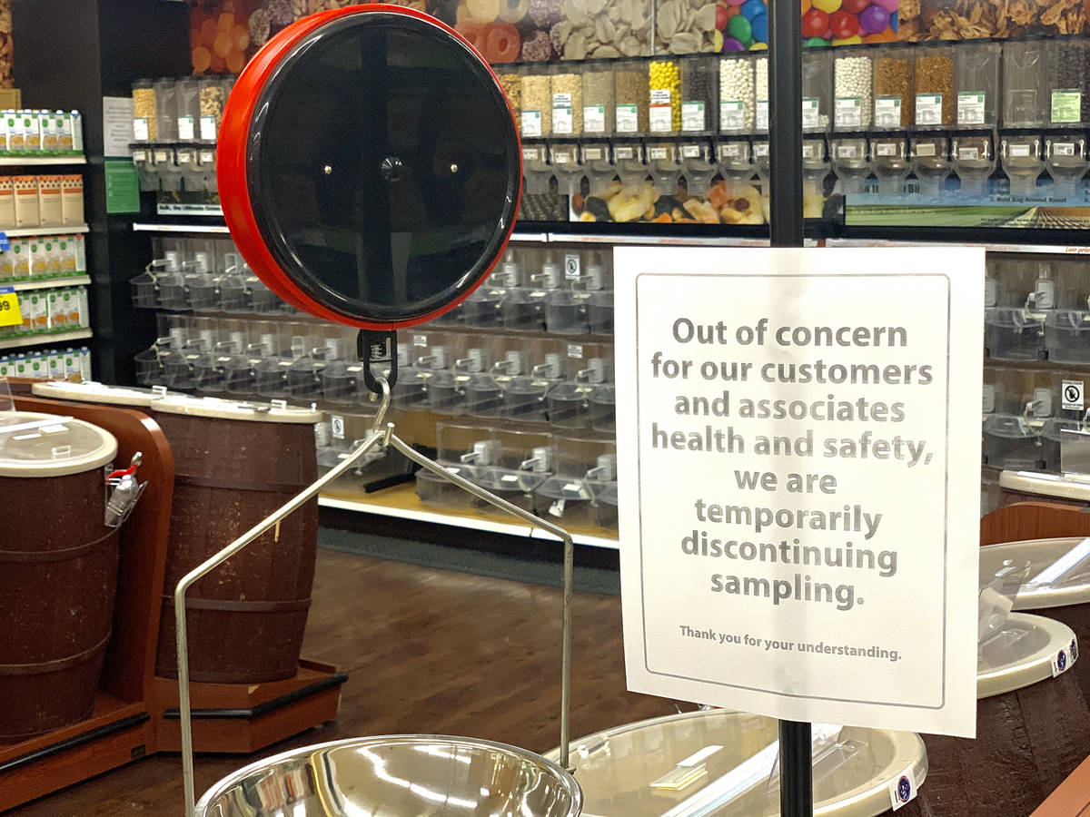 A sign lets shoppers know new policies at the Smith's store on E Sunset Road in Henderson on Tu ...