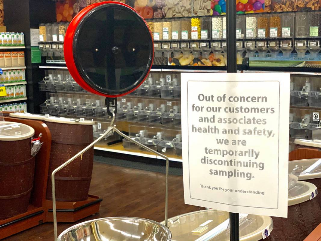 A sign lets shoppers know new policies at the Smith's store on E Sunset Road in Henderson on Tu ...