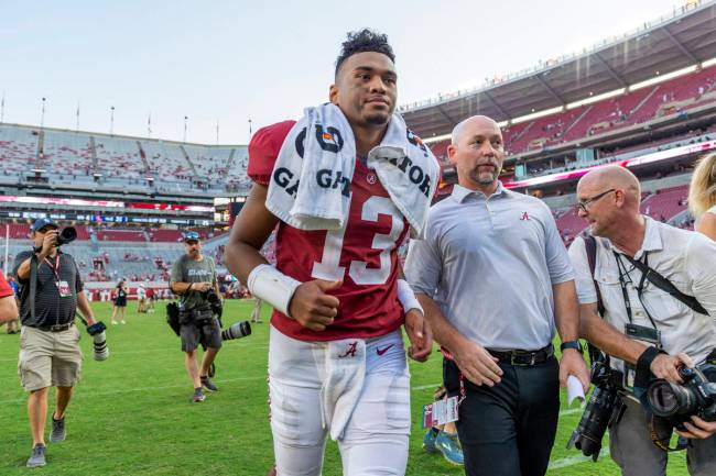 Alabama quarterback Tua Tagovailoa (13) jogs off the field after a victory over Mississippi in ...