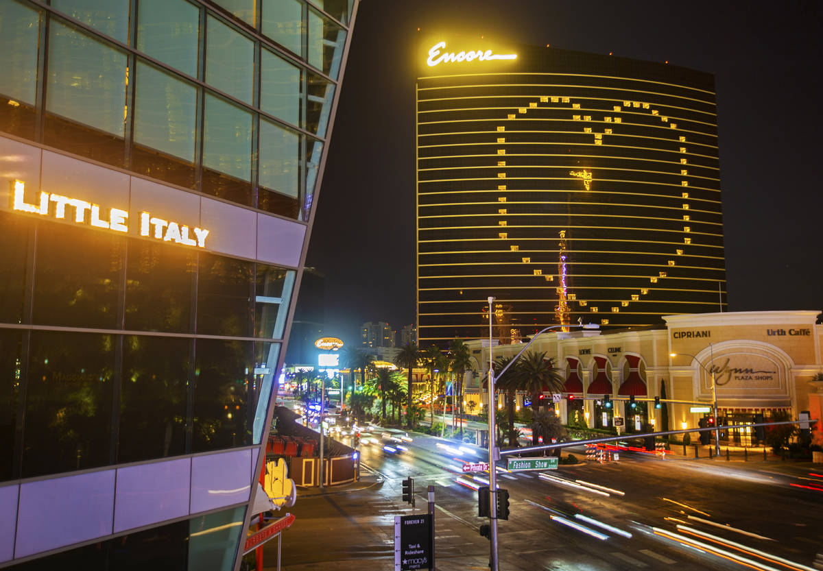 Traffic on the Strip passes by signage on Encore showing support for Las Vegas during the coron ...