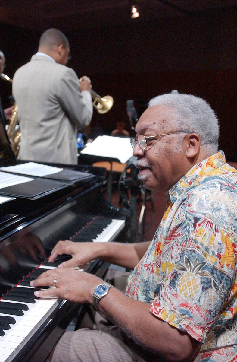 **FILE** Ellis Marsalis plays the piano while his son, Wynton, tries his trumpet during the so ...