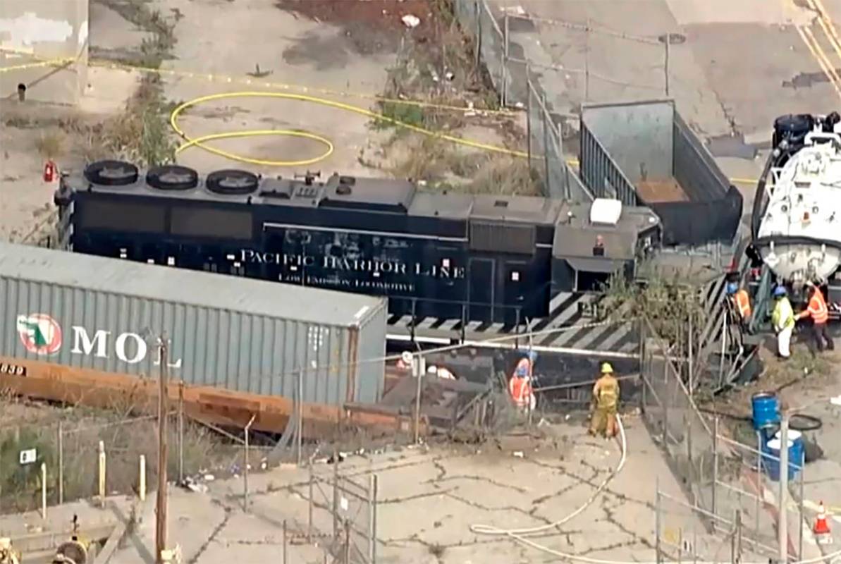 This aerial image taken from video provided by KABC-TV shows a Pacific Harbor Line train that d ...