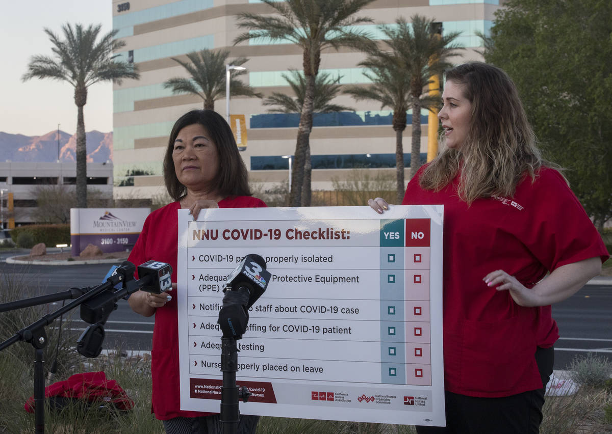 Dina Armstrong, a nurse and chief nurse for National Nurses Untied, left, addresses the media a ...