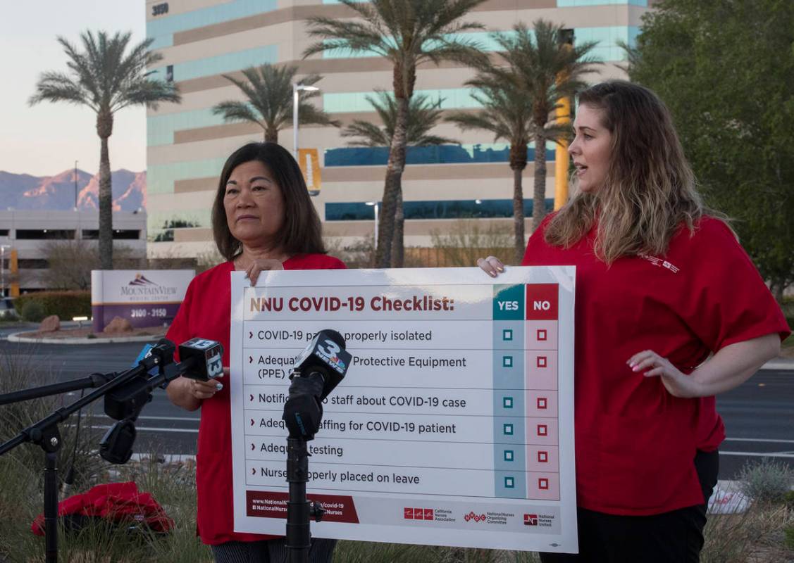 Dina Armstrong, a nurse and chief nurse for National Nurses Untied, left, addresses the media a ...