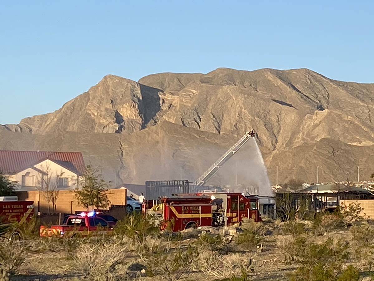 Firefighters battle a two-alarm fire in the 9600 block of West La Madre Way, near West Lone Mou ...