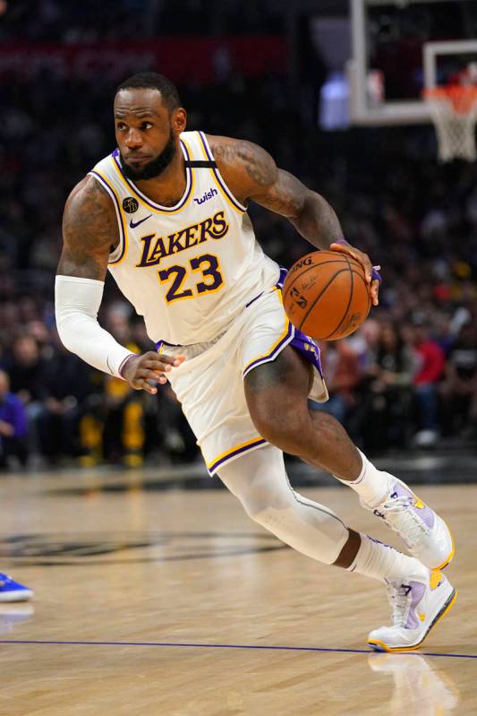 Los Angeles Lakers forward LeBron James drives toward the basket during the second half of an N ...