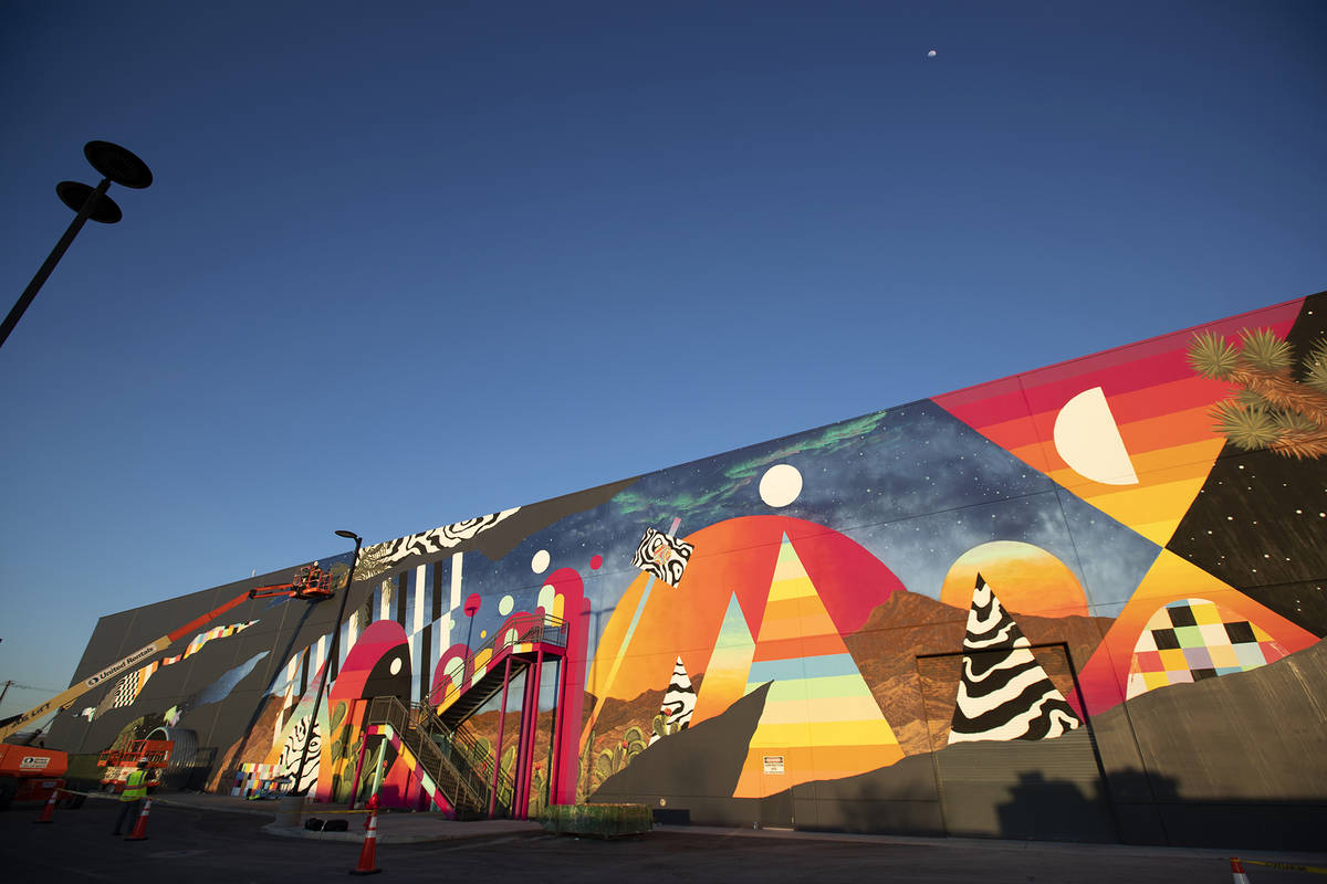 Eric Vozzola working on his mural at Area 15, Las Vegas, NV ( Kate Russell, Courtesy of Meow Wolf)