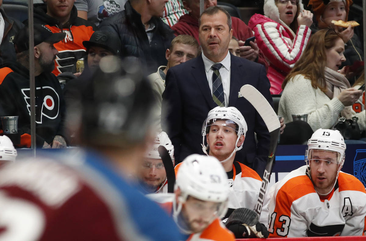 Philadelphia Flyers head coach Alain Vigneault looks on from the team box in the second period ...