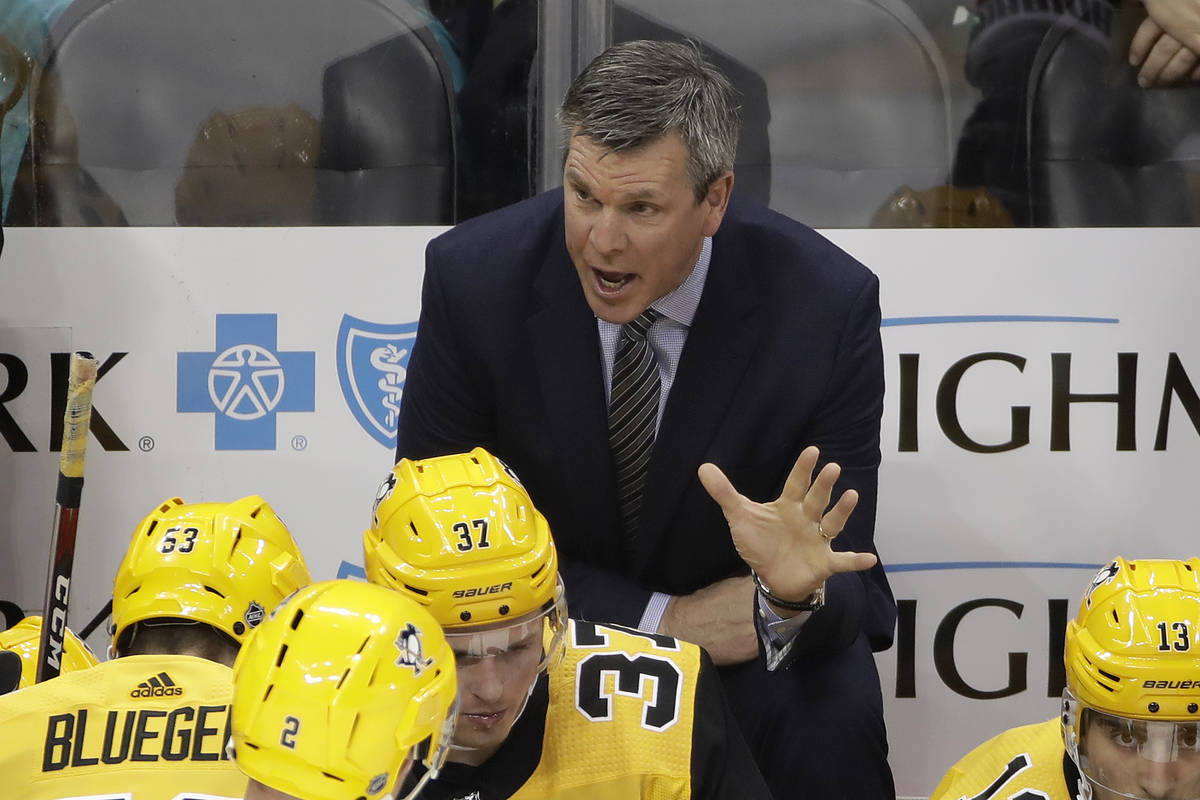 Pittsburgh Penguins head coach Mike Sullivan gives instruction during a timeout in the first pe ...