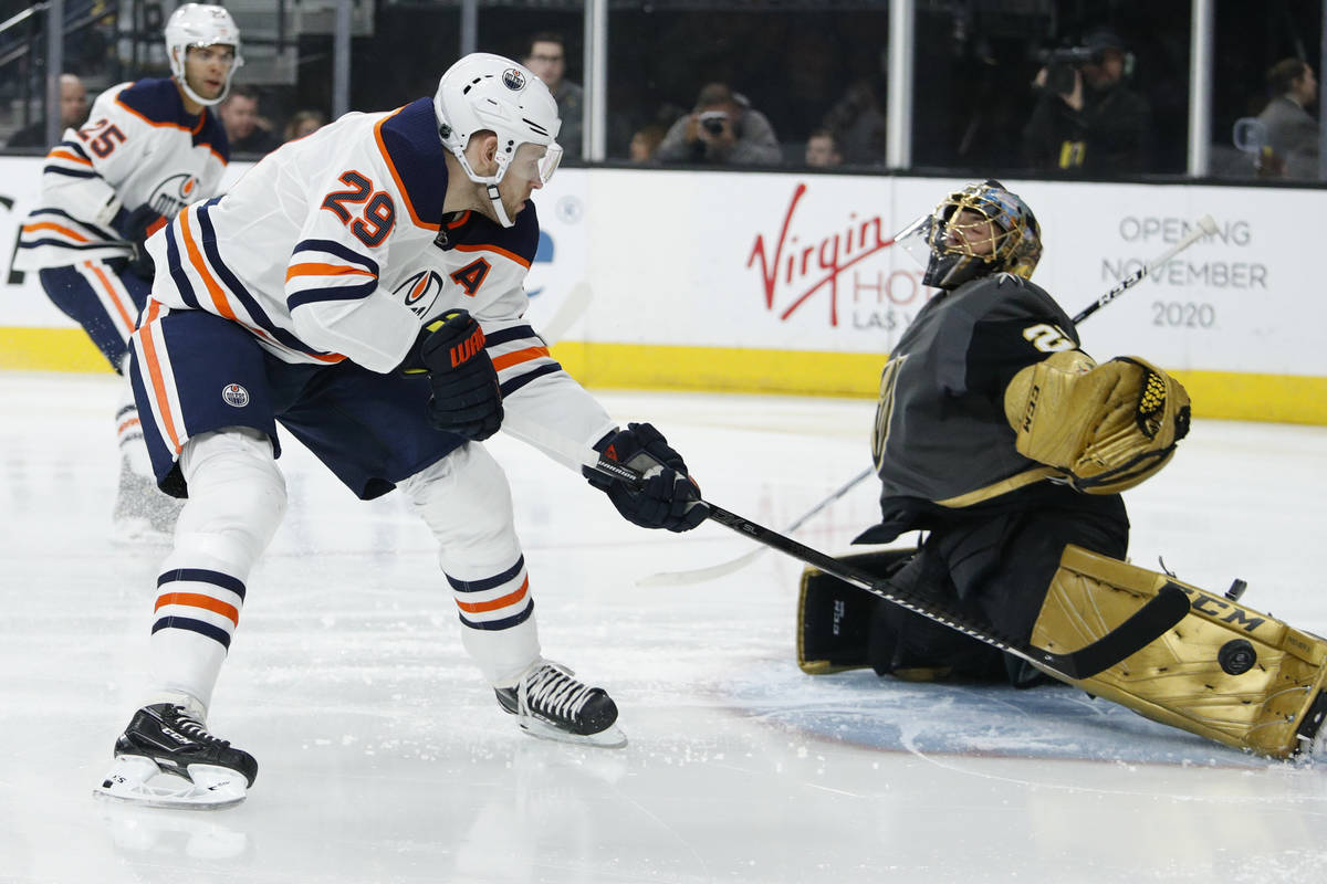 Edmonton Oilers center Leon Draisaitl (29) takes a shot on Vegas Golden Knights goaltender Marc ...