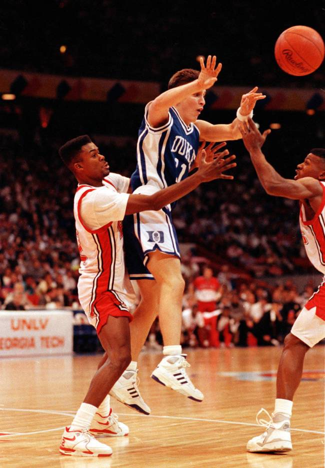 Duke guard Bobby Hurley is trapped by UNLV guard Anderson Hunt, left, and Stacey Augmon, right, ...