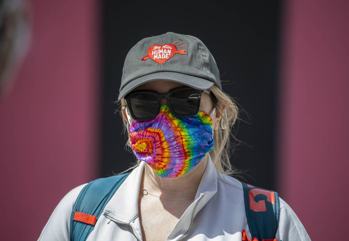 Porsha Willey wears a protective mask in downtown Las Vegas on Friday, April 3, 2020. (Benjamin ...