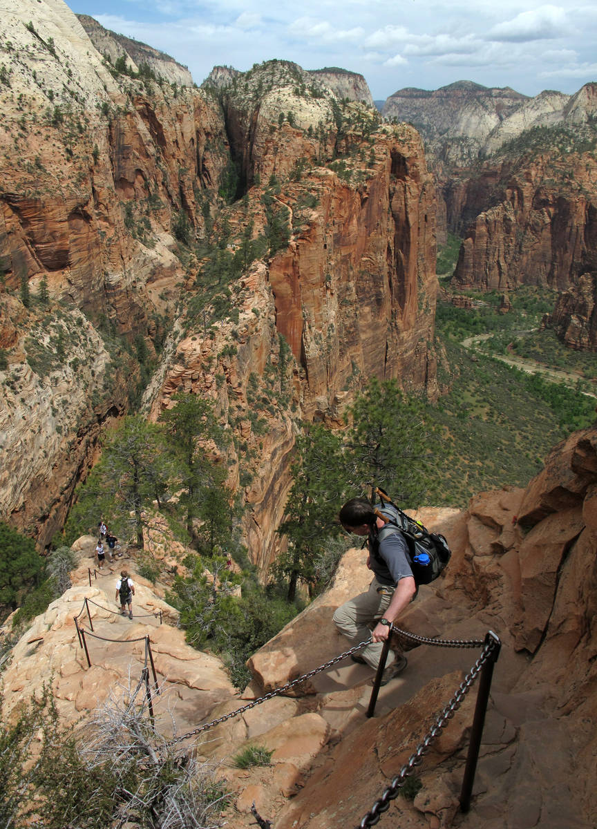 In this May 8, 2011, file photo, hikers climb down the Angels Landing trail in Zion National Pa ...