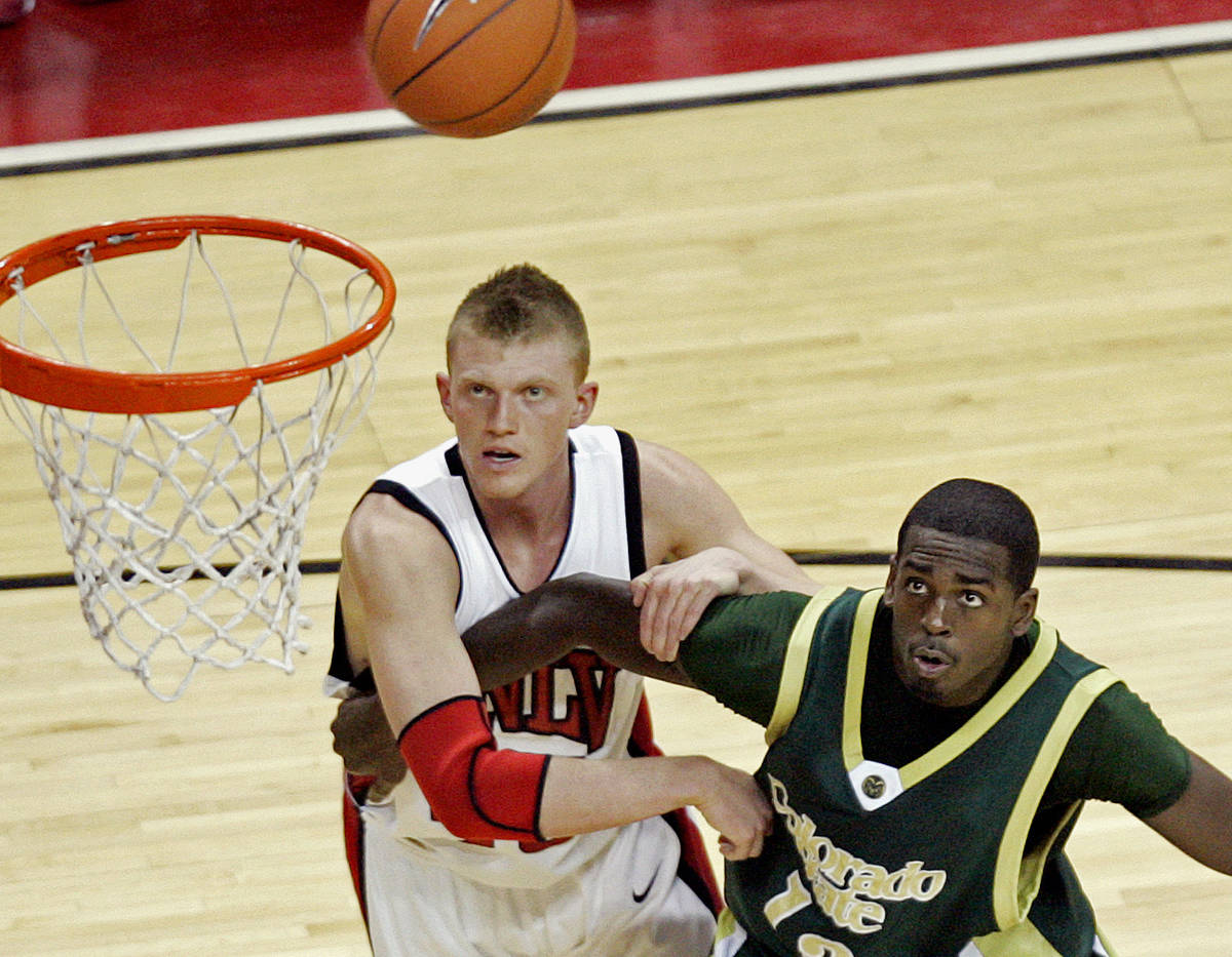 UNLV's Joe Darger, left, boxes out CSU's Andre McFarland during a basketball game at the Thomas ...