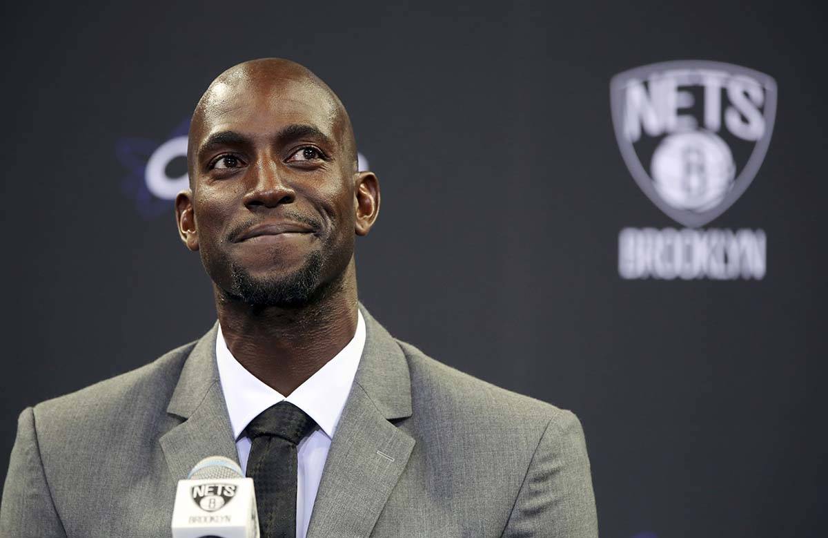 In this July 18, 2013 file photo, Kevin Garnett smiles as he speaks to reporters during an NBA ...