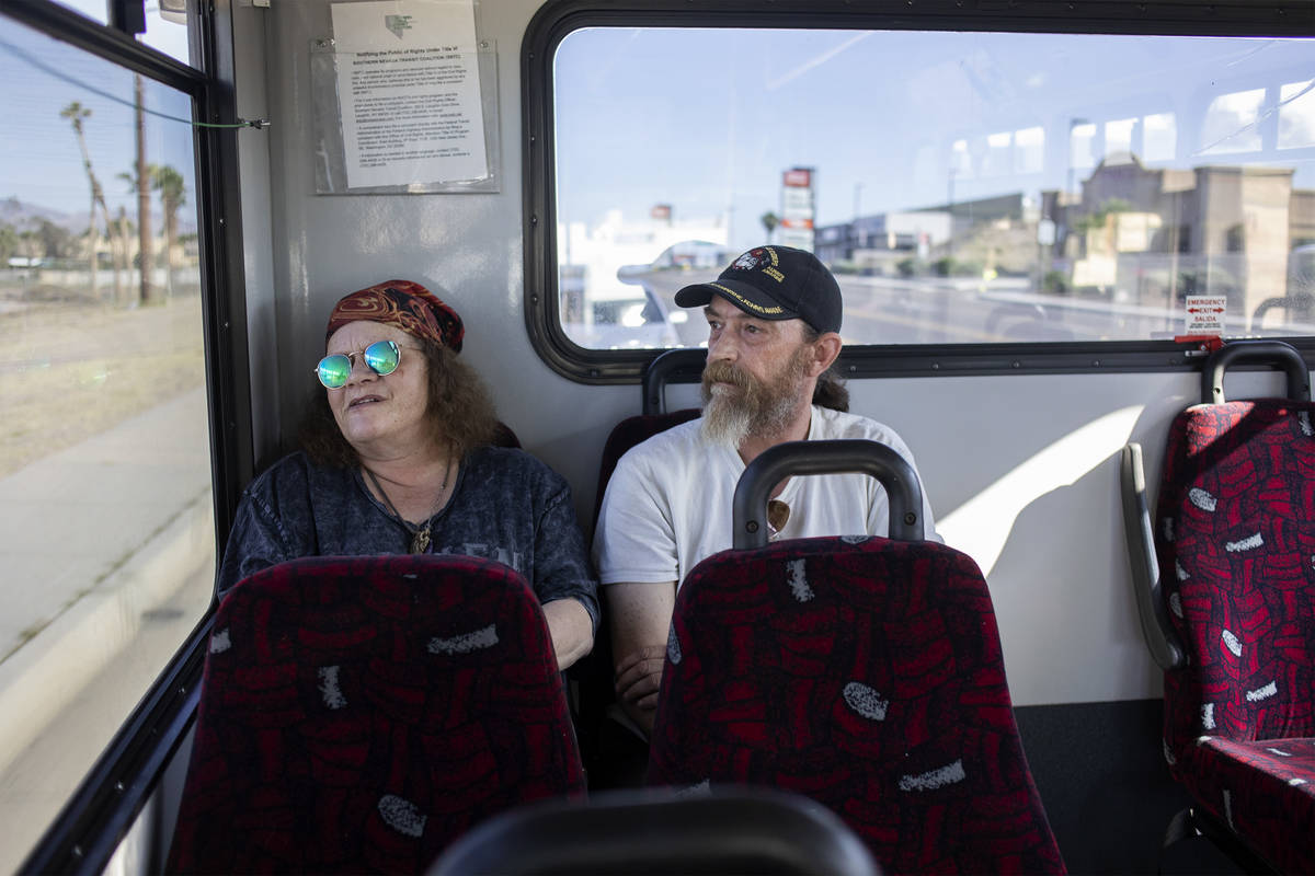 Debbie Holmgren, left, and Todd Henke ride a bus from Laughlin, Nev. to Bullhead City, Ariz., o ...