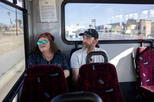 Debbie Holmgren, left, and Todd Henke ride a bus from Laughlin, Nev. to Bullhead City, Ariz., o ...