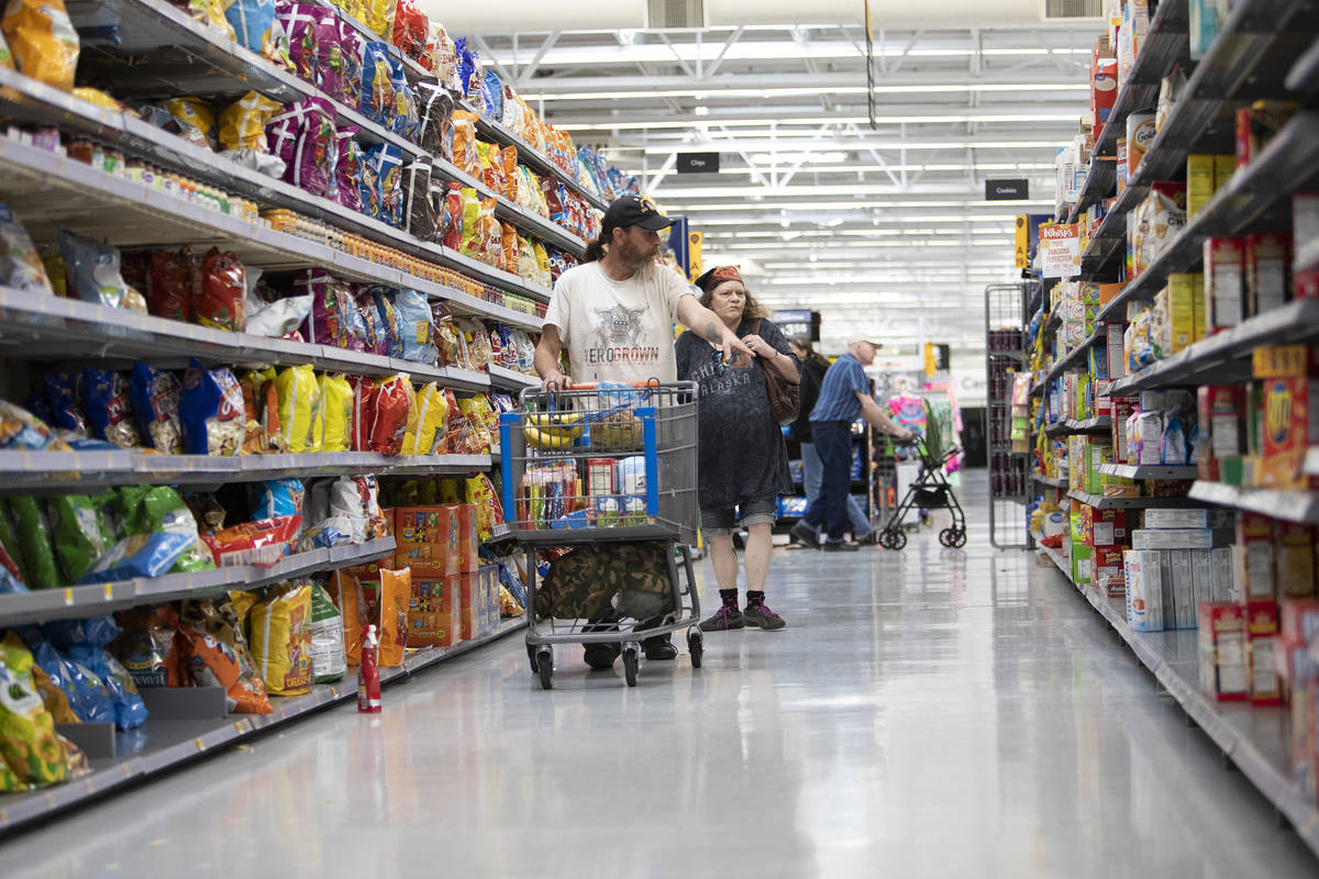 Debbie Holmgren and Todd Henke shop for food at Walmart on Saturday, April 4, 2020, in Bullhead ...