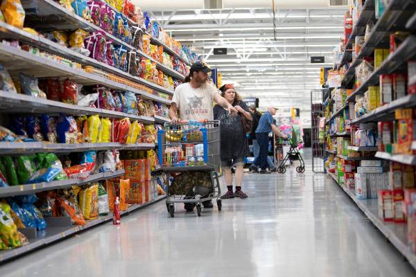 Debbie Holmgren and Todd Henke shop for food at Walmart on Saturday, April 4, 2020, in Bullhead ...