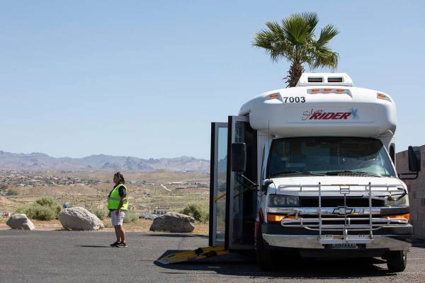 Bus driver Beverly Osko waits for passengers to arrive for a trip to the grocery store from Lau ...