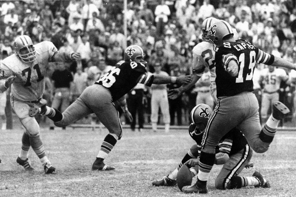 FILE - In this Nov. 8, 1970, file photo, New Orleans Saints' Tom Dempsey (19) moves up to kick ...
