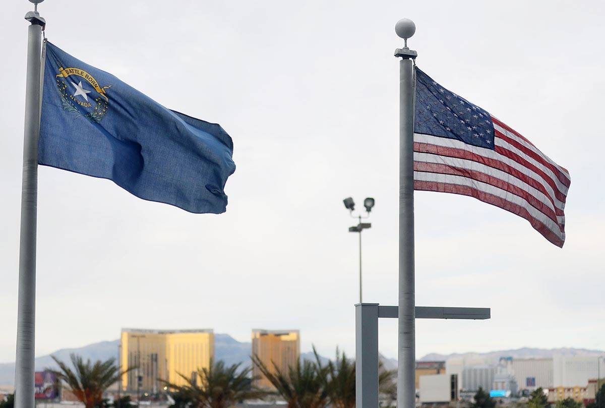 Winds cause flags to move as grey clouds move in on the Las Vegas Strip seen at the Thomas &amp ...