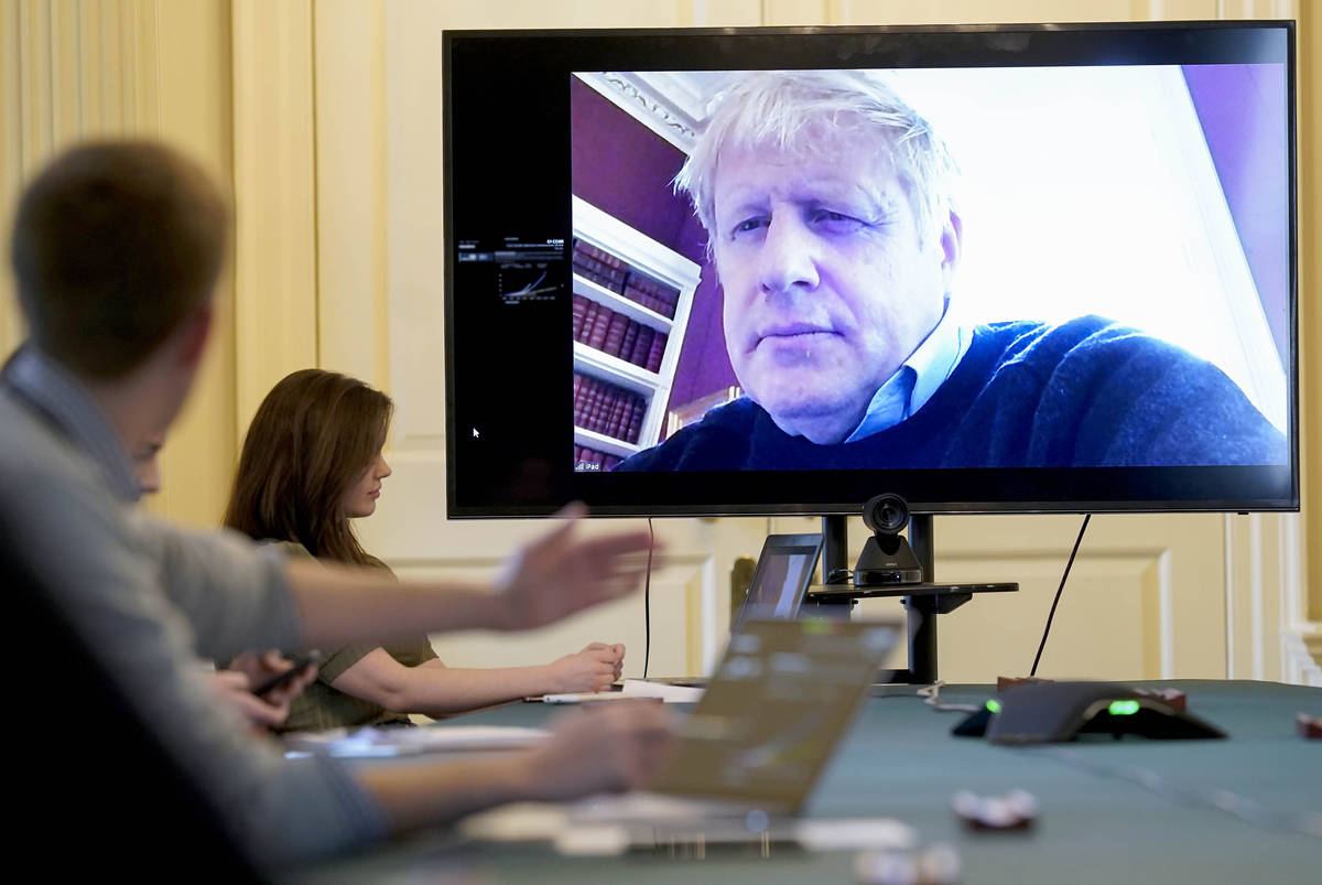 Britain's Prime Minister Boris Johnson chairs the morning Covid-19 Meeting remotely after self- ...