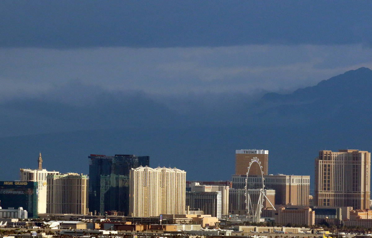 Sun shines on the Strip as a dark cloud linger over the Las Vegas valley on Tuesday, April 7, 2 ...