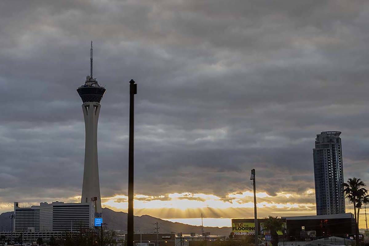 The sun peeks through gray clouds in Las Vegas on Tuesday, April 7, 2020. Rain is expected in t ...