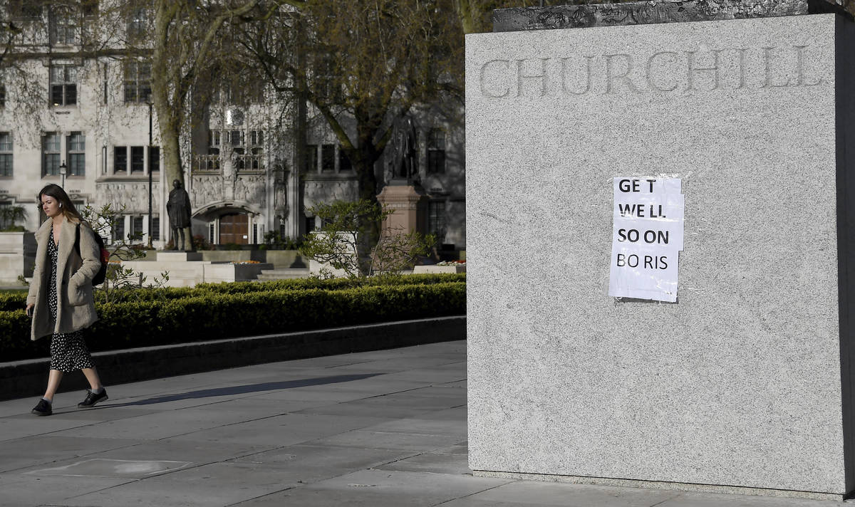 People have put a paper saying 'Get Well Soon Boris' on the statue of Winston Churchill in cent ...
