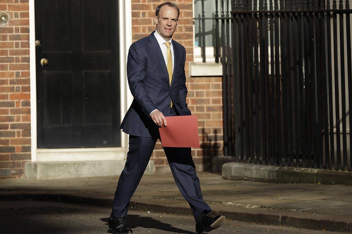 Britain's Secretary of State for Foreign Affairs, Dominic Raab, arrives in Downing Street as Br ...
