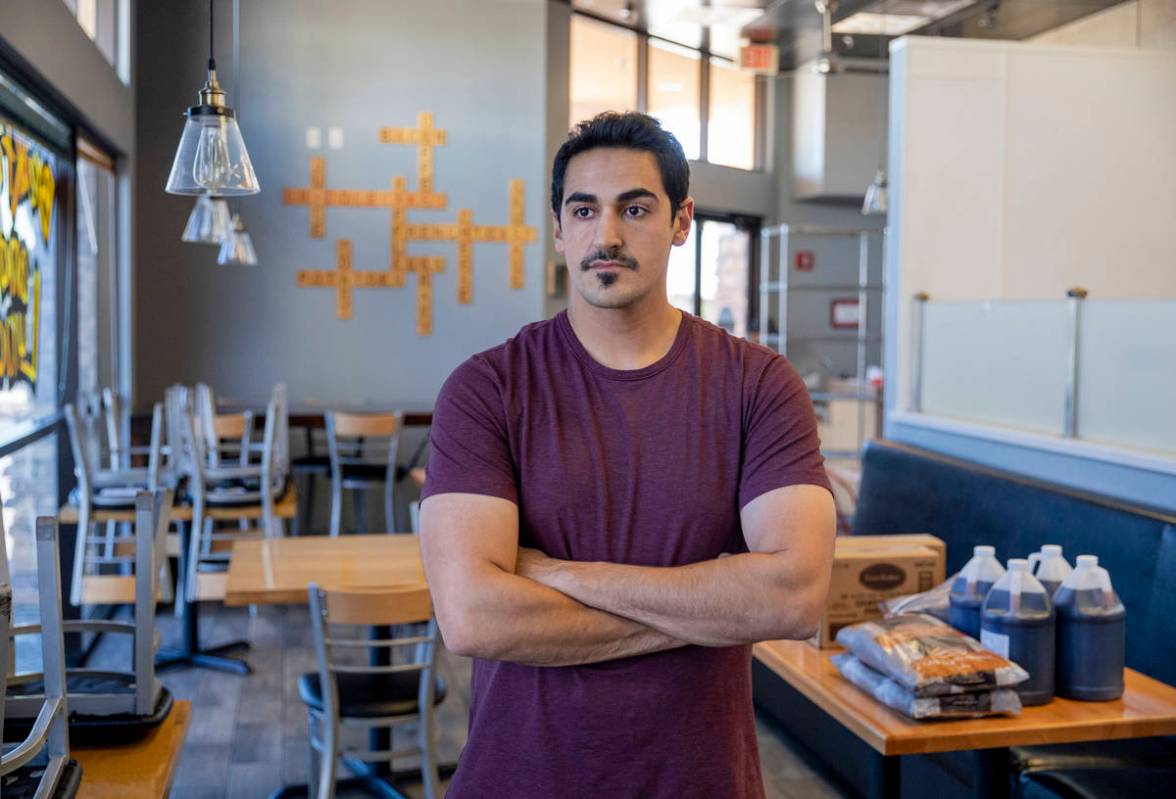 Hamed Emamzadeh, owner of Griddlecakes on S Fort Apache Road, is photographed in his restaurant ...
