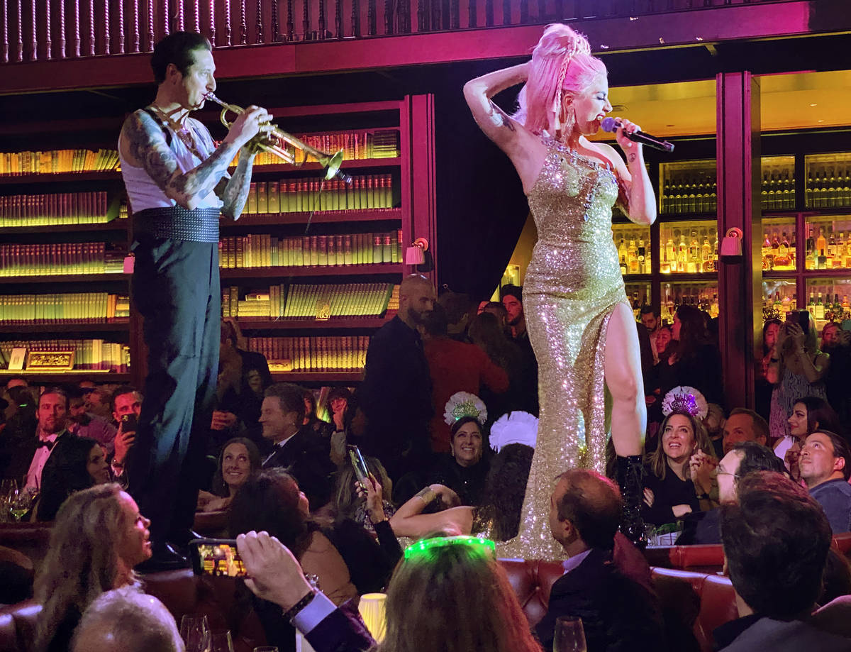 Brian Newman and Lady Gaga perform at NoMad Restaurant at Park MGM on the Strip on New Year's D ...