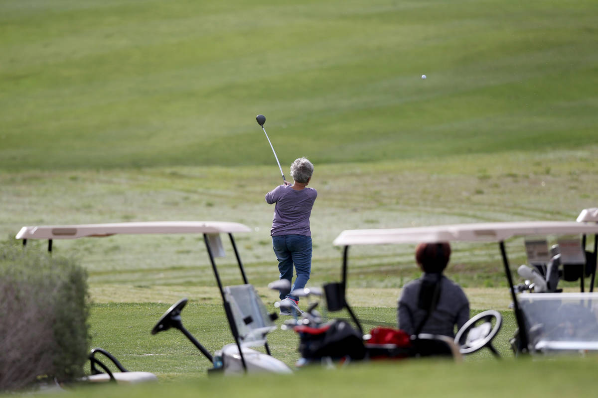 Golfers at Las Vegas National Golf Club Wednesday, April 8, 2020. Golf courses have closed club ...