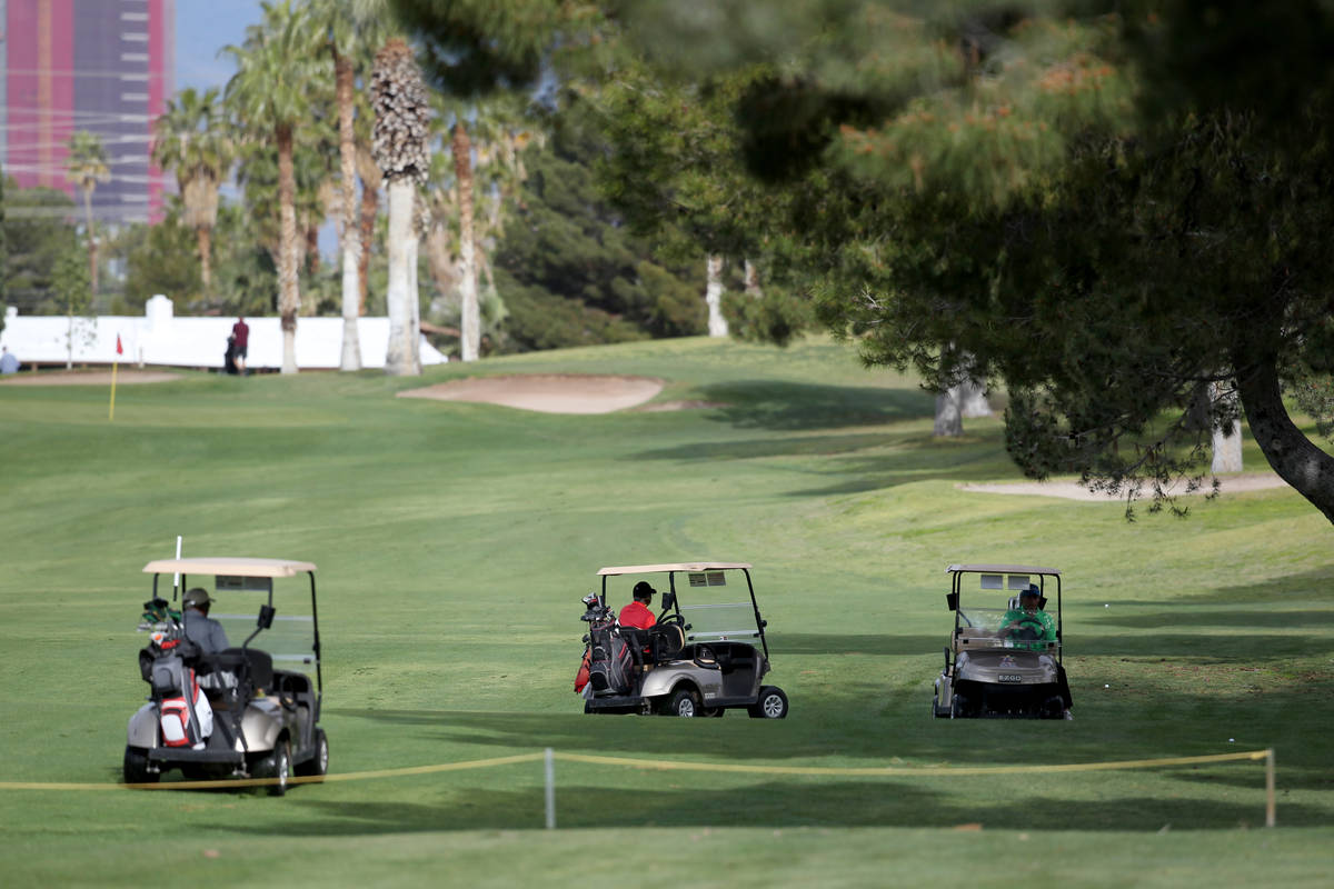 Golfers at Las Vegas National Golf Club Wednesday, April 8, 2020. Golf courses have closed club ...