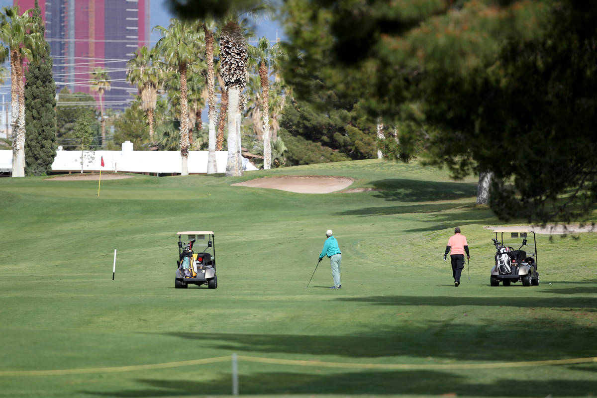 Golfers at Las Vegas National Golf Club Wednesday, April 8, 2020. Golf courses have closed club ...