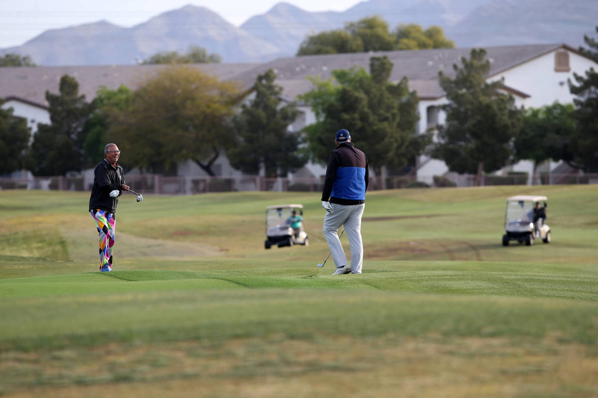 Golfers at The Club at Sunrise in Las Vegas Wednesday, April 8, 2020. Golf courses have closed ...