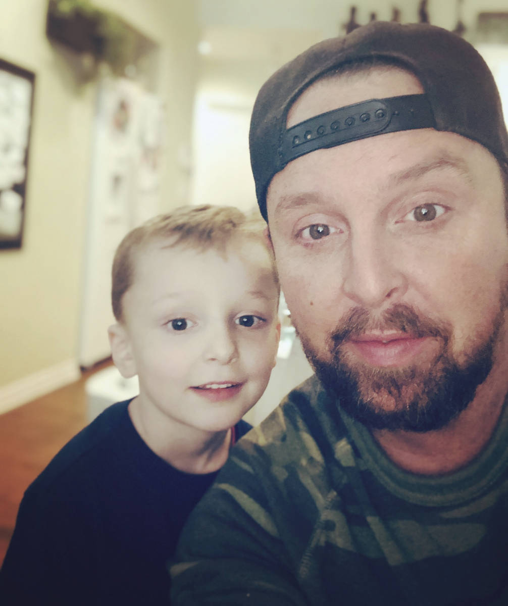 Justin Carder poses with his son, Layne, in this undated photo. (Justin Carder)