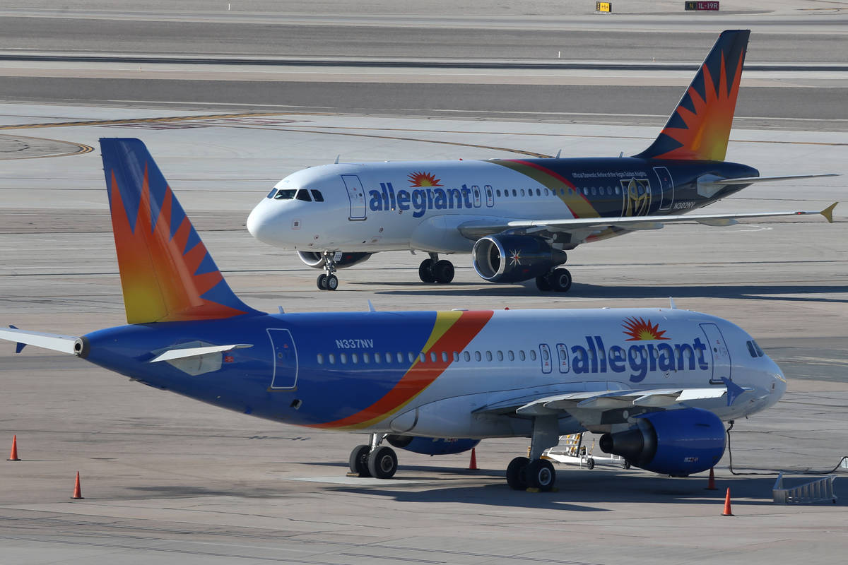 Two Allegiant Air airplanes are seen on the tarmac at McCarran International Airport in Las Veg ...