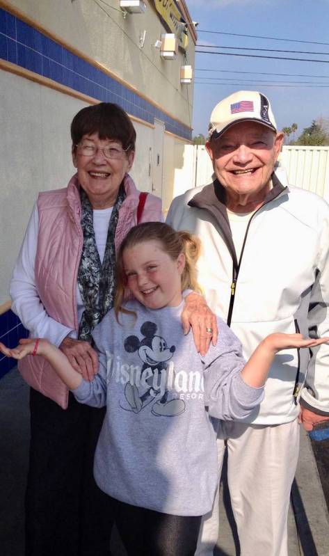 WWII Army veteran Edward Turken poses for a photo with his wife, Eva, and their granddaughter, ...