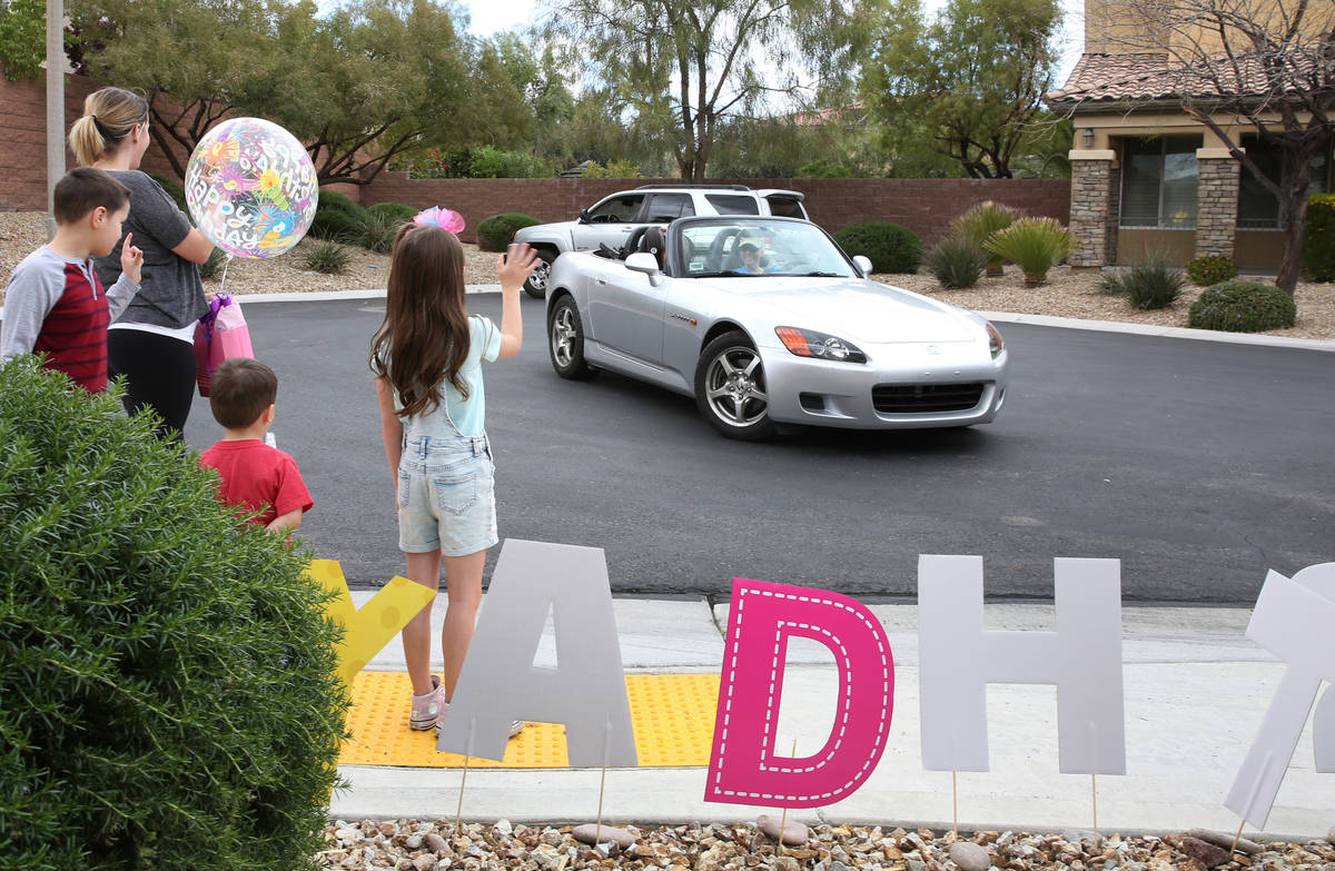 Tenley Hynds, right, waves to her friends and cousins who came to celebrate her 8th birthday wh ...