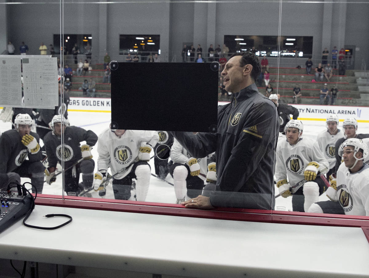 The Chicago Wolfs' coach Rocky Thompson lays out a practice plan for the Vegas Golden Knights d ...