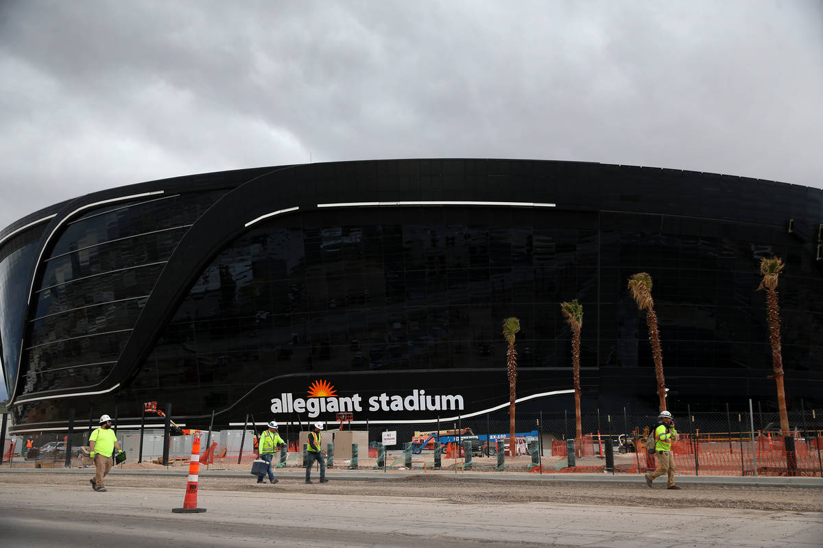 Workers leave at the end of their shift at the Raiders Allegiant Stadium in Las Vegas, Wednesda ...