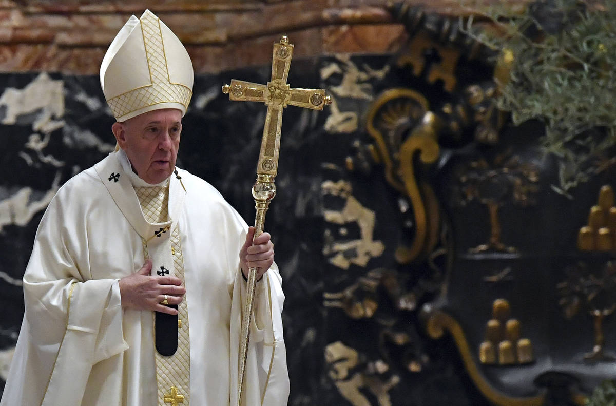 Pope Francis attends a Mass for Holy Thursday, inside St. Peter's Basilica at the Vatican, Thur ...